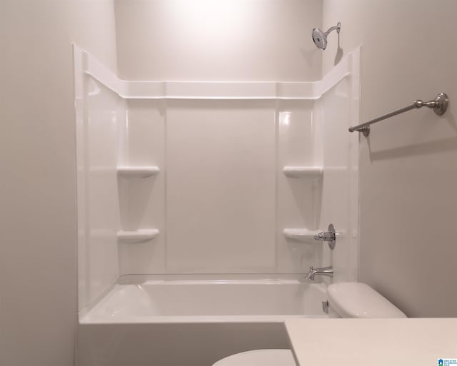 bathroom featuring toilet and tub / shower combination