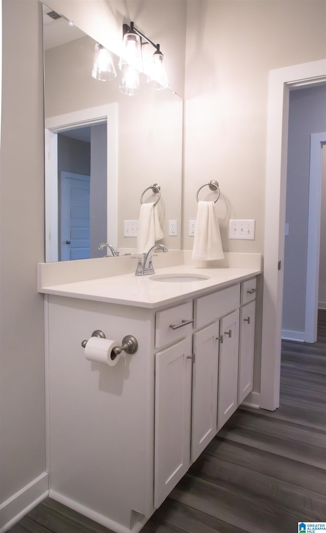 bathroom with vanity and wood-type flooring