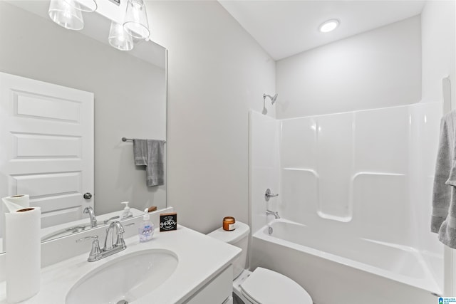 full bathroom featuring vanity,  shower combination, and toilet