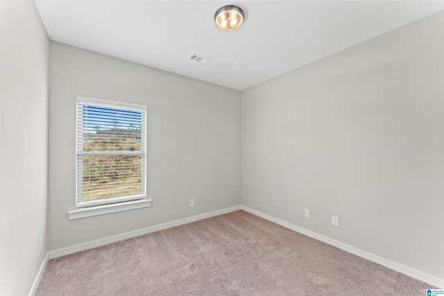 empty room with light colored carpet