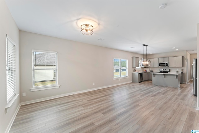 unfurnished living room with light hardwood / wood-style floors