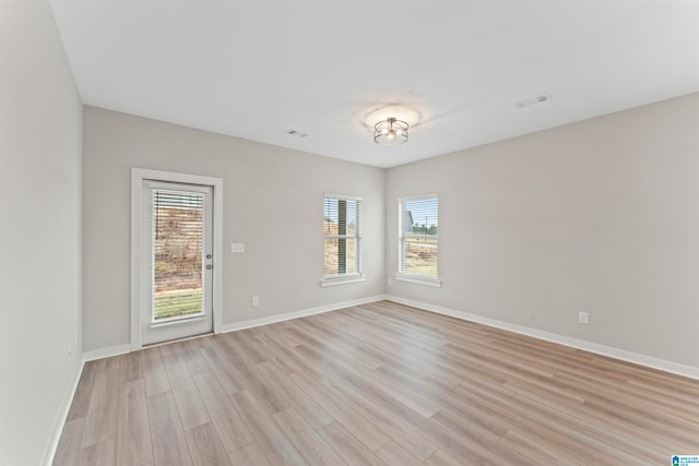 unfurnished room featuring light wood-type flooring