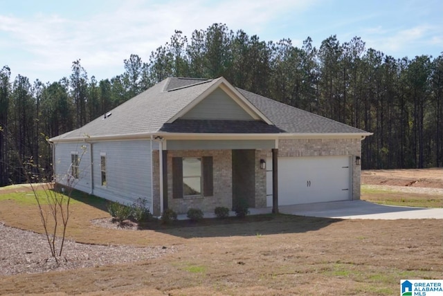 view of front of property with a porch and a garage