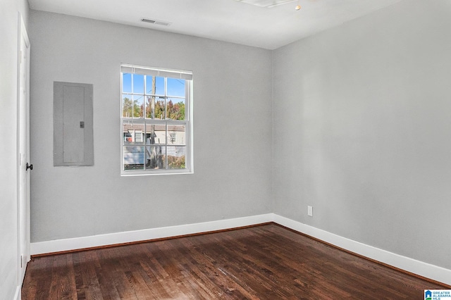 empty room featuring hardwood / wood-style flooring and electric panel