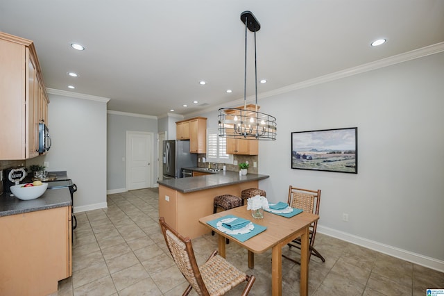 tiled dining room with crown molding and sink