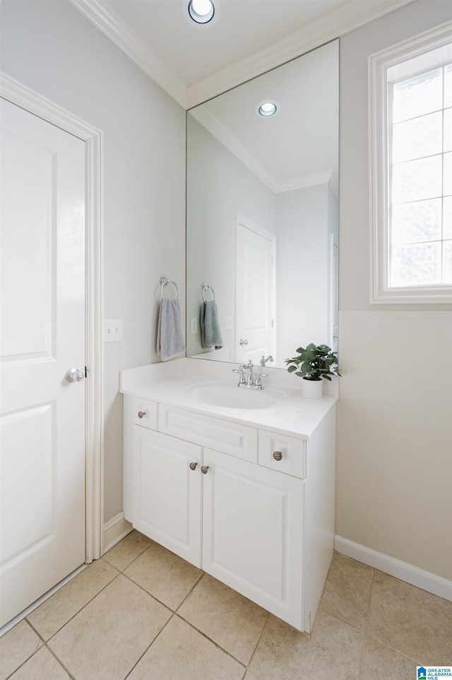 bathroom with tile patterned flooring, a healthy amount of sunlight, and crown molding