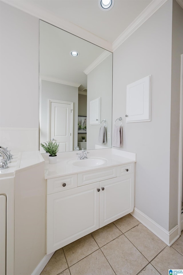 bathroom with tile patterned flooring, vanity, and ornamental molding