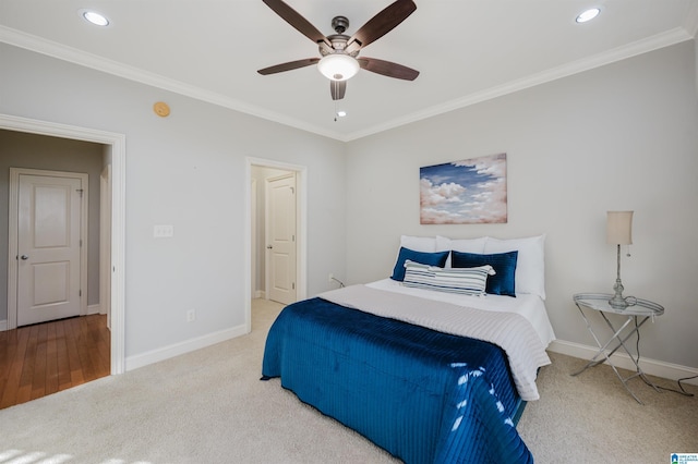 bedroom with ceiling fan, carpet, and ornamental molding