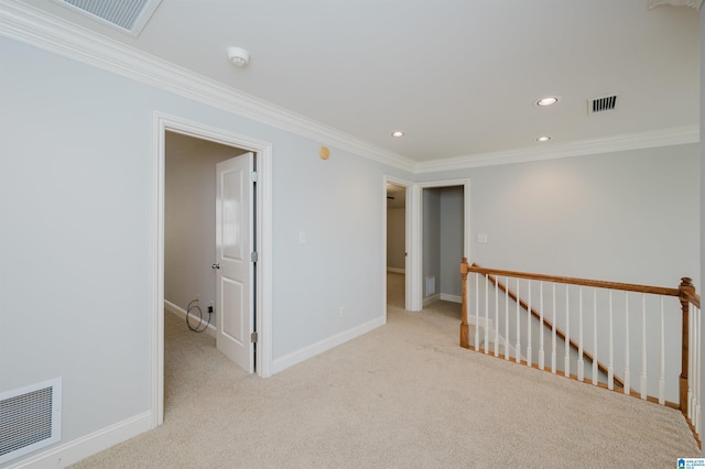 carpeted empty room with crown molding