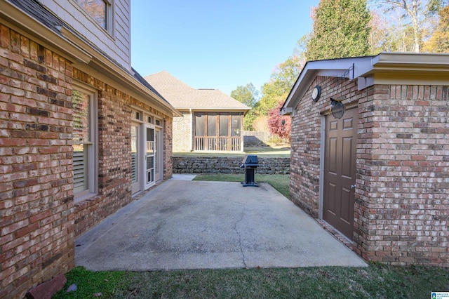 view of patio / terrace with a sunroom