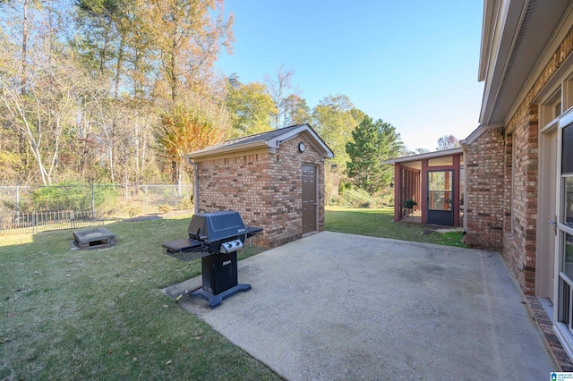 view of patio featuring an outbuilding and area for grilling