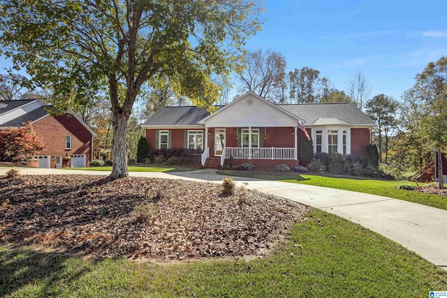 ranch-style home with covered porch, a garage, and a front lawn