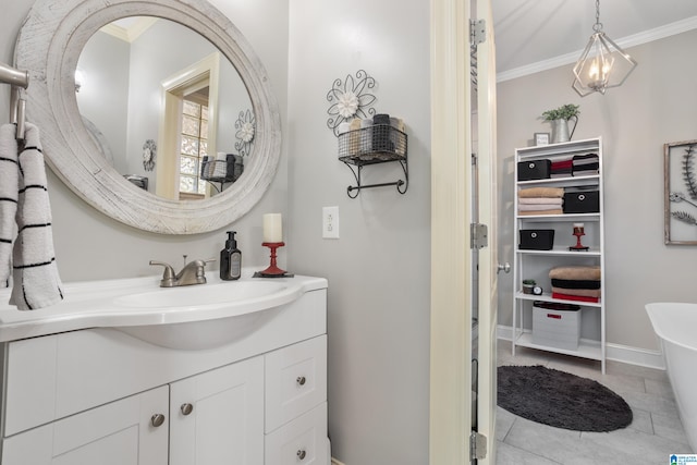 bathroom featuring tile patterned floors, vanity, and crown molding