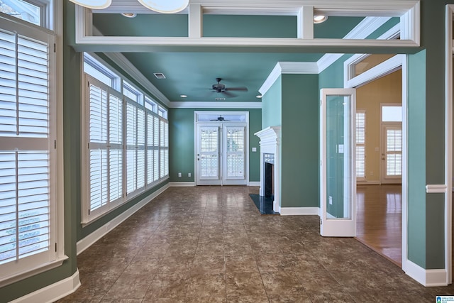 interior space featuring ceiling fan, ornamental molding, and french doors