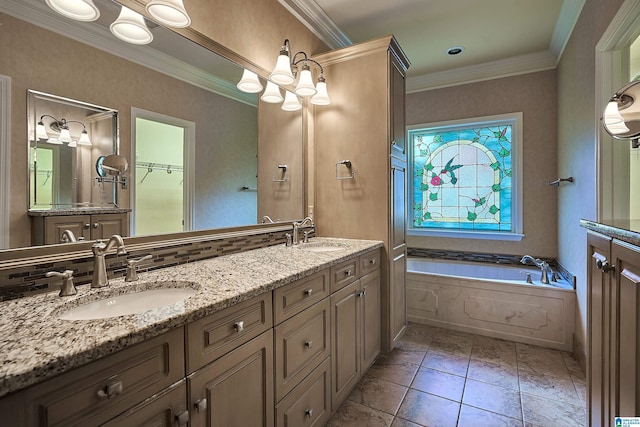 bathroom featuring tile patterned flooring, vanity, crown molding, and tiled tub