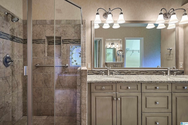 bathroom with vanity and an enclosed shower