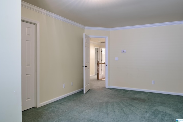 unfurnished room with carpet floors and crown molding