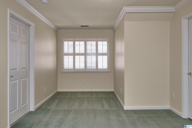 spare room with carpet floors and crown molding