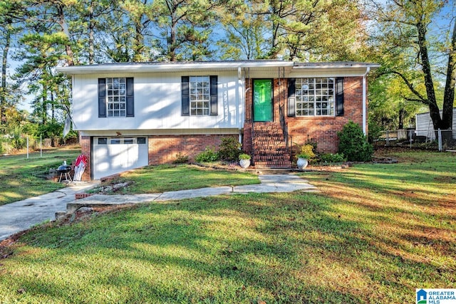 view of front of property with driveway, a front yard, and brick siding