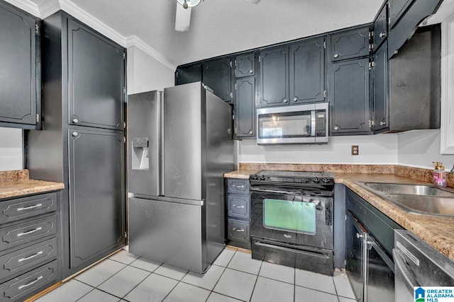 kitchen with sink, stainless steel appliances, crown molding, a textured ceiling, and light tile patterned flooring