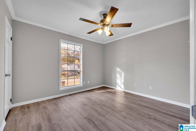 unfurnished room with a textured ceiling, ceiling fan, crown molding, and light hardwood / wood-style flooring