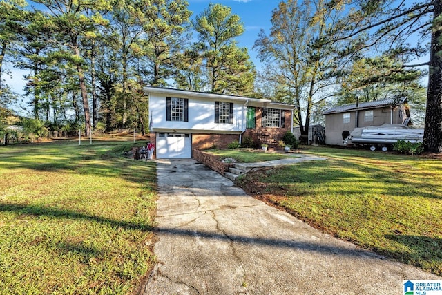 view of front facade with driveway, a garage, a front lawn, and brick siding