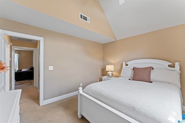 carpeted bedroom featuring lofted ceiling