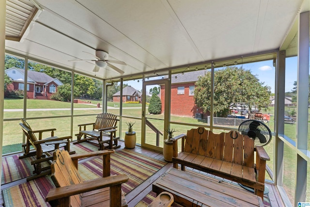 sunroom / solarium with ceiling fan and a healthy amount of sunlight