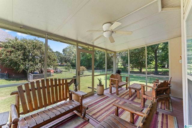 sunroom featuring a wealth of natural light and ceiling fan