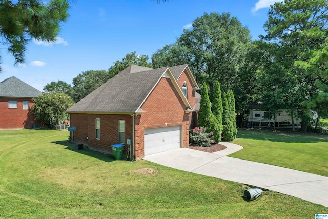 view of front facade with a garage and a front lawn