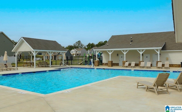 view of swimming pool with a gazebo and a patio area