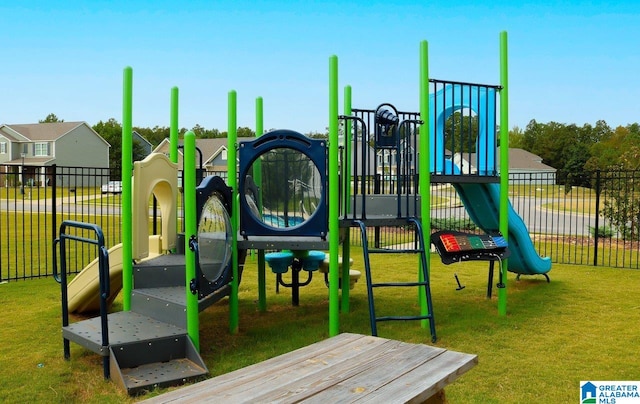 view of playground with a lawn