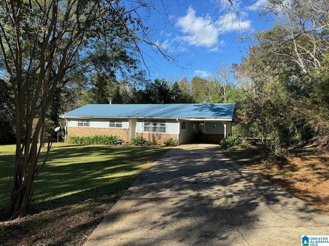 ranch-style home with a front lawn and a carport