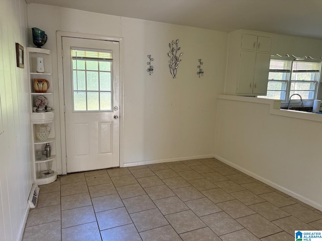 entryway featuring light tile patterned floors