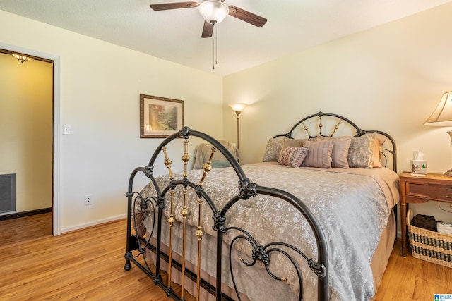 bedroom with ceiling fan and light hardwood / wood-style flooring