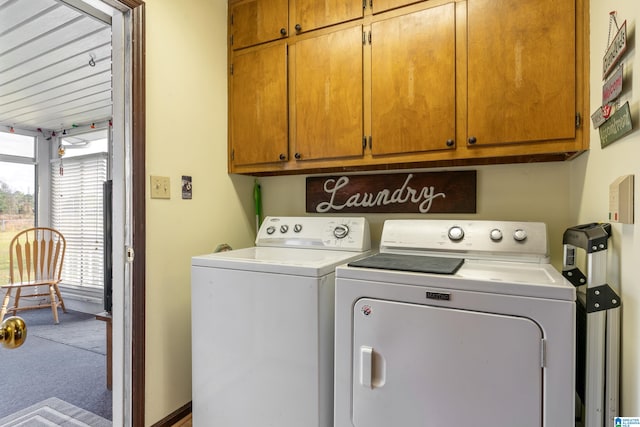 laundry room featuring cabinets, carpet, and washing machine and dryer