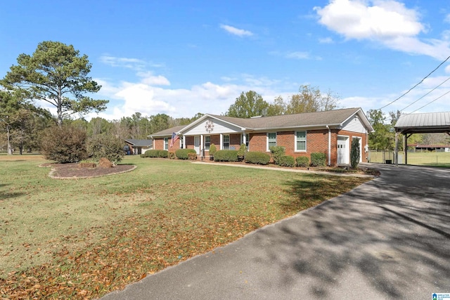 ranch-style home with a carport and a front lawn