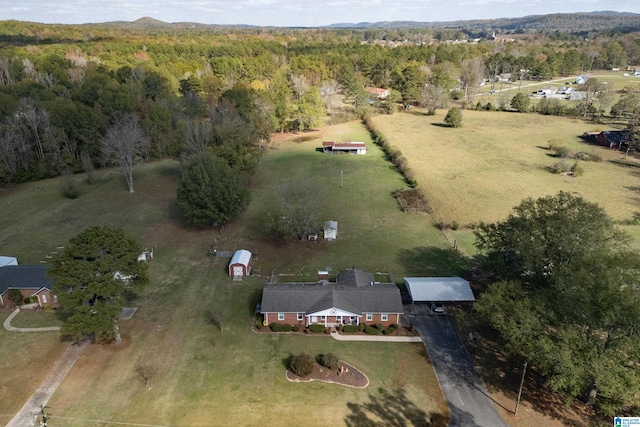 birds eye view of property featuring a rural view