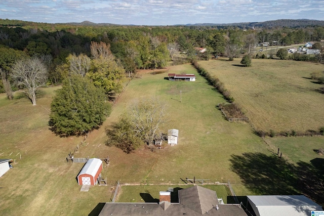 birds eye view of property featuring a rural view