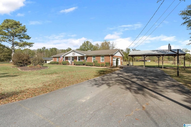 view of front of property with a carport and a front yard