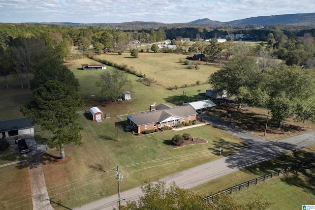 birds eye view of property featuring a mountain view and a rural view