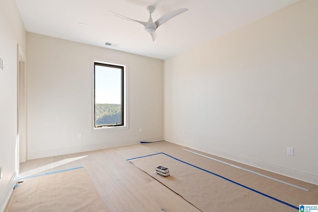 unfurnished room featuring light wood-type flooring and ceiling fan