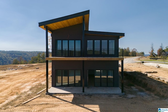 rear view of property featuring a patio