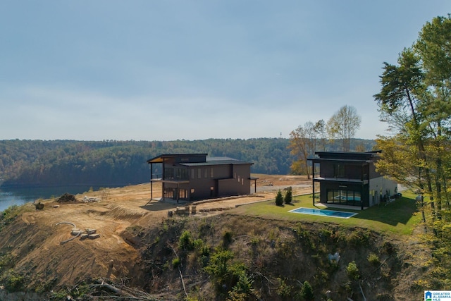 birds eye view of property with a rural view