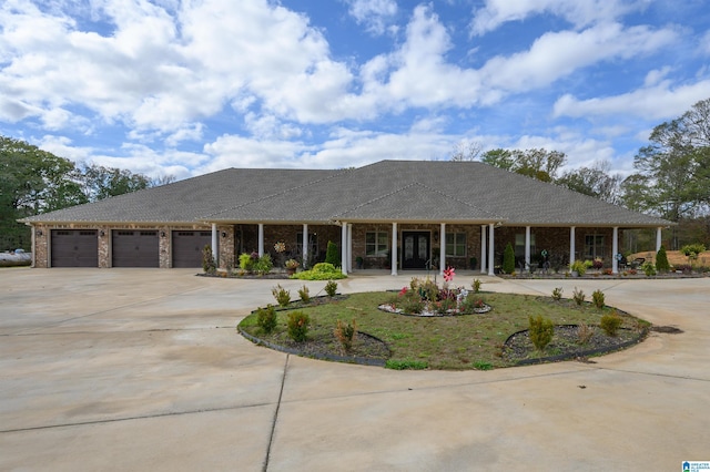 view of front of home with covered porch and a garage