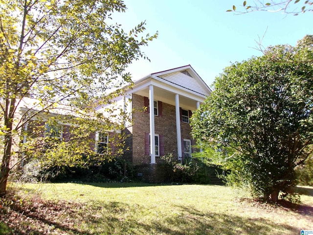 view of property exterior featuring a yard