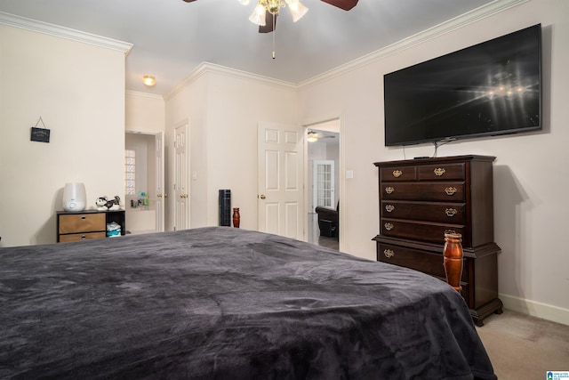 bedroom featuring carpet flooring, ceiling fan, and crown molding