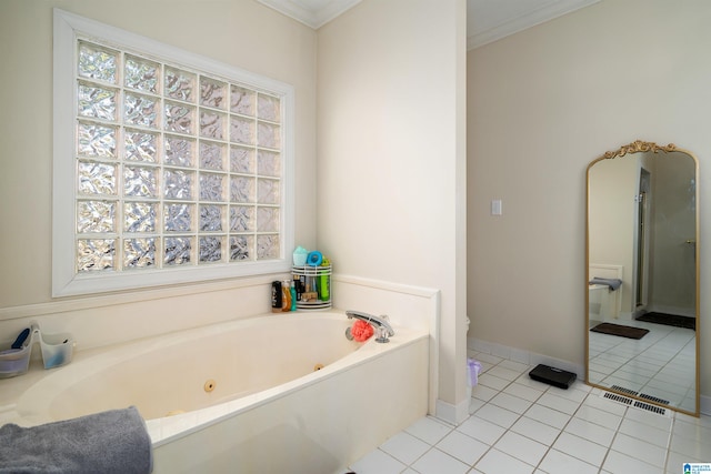 bathroom with tile patterned flooring, a tub, and crown molding