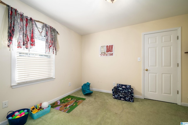 recreation room with carpet flooring