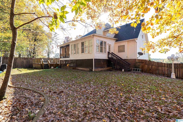 back of house with a deck and a sunroom